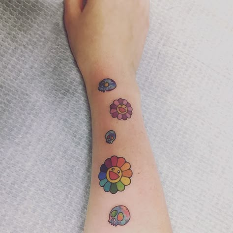 So in love with my Murakami tattoo. The rainbow flower makes me happy whenever I look at it. Flower With Smiley Face Tattoo, Happy Face Flower Tattoo, Murakami Tattoo Ideas, Happy Flower Tattoo, Takashi Murakami Flower Tattoo, Takashi Murakami Tattoo, Rainbow Flower Tattoo, Murakami Flower Tattoo, Flower Power Tattoo