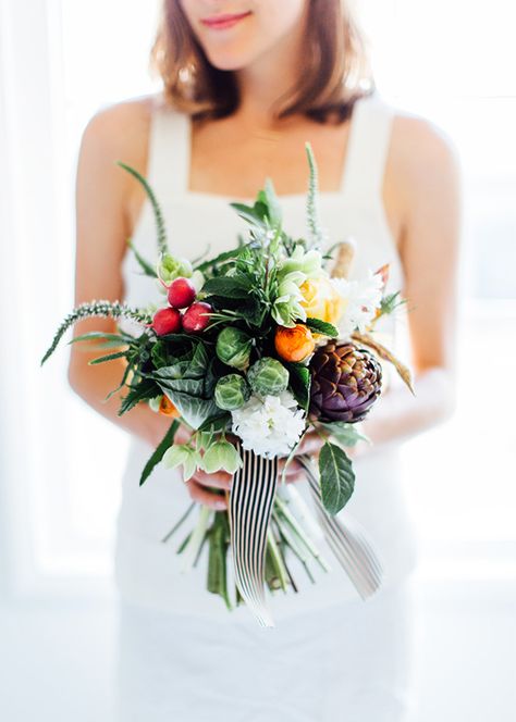 Lately, I’ve been obsessed with the idea of vegetables in bouquets and arrangements. Not only are they brightly colored and inexpensive, but the shapes and textures make such a gorgeous addition to your standard bouquet. I asked my florist friend, Anne of Fleurish CA, to come to the studio and help us put one together. Over … Vegetable Bouquet, Unique Wedding Bouquet, Diy Wedding On A Budget, Diy Backyard Wedding, Mother's Day Bouquet, Diy Wedding Backdrop, Rustic Wedding Diy, Wedding Centerpieces Diy, Diy Wedding Favors