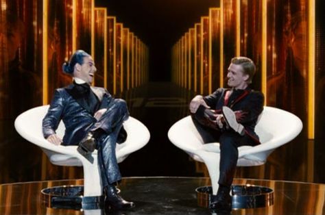 Caesar Flickerman interviews Peeta Mellark Hunger Games Caesar Flickerman, Caesar Flickerman, Hunger Games Interview, Hunger Games 2, Peeta Mellark, Tv Set, Movie Sets, The Hunger Games, The Hunger