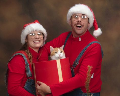 My wife and I recently had out Christmas photos done...We even borrowed a cat for extra cringe. Cat Family Christmas Cards, Christmas Pictures With Cats Family Photos, Couples Holiday Cards, 90s Christmas Card Photo, 90s Christmas Pictures, Cheesy Family Christmas Photos, Christmas Card Ideas With Cats, Family Christmas Pictures With Cat, Corny Christmas Photos