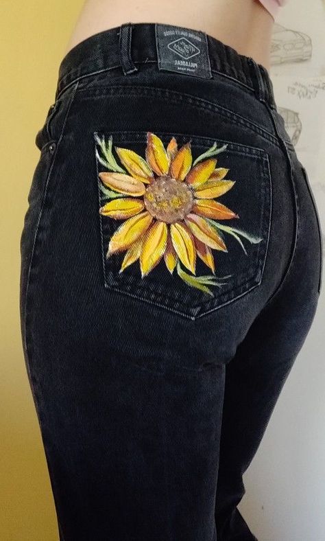 Pants With Paint On Them, Sunflower Painted Jeans, Flower Painted Jeans, Painting On Black Tshirt, Painting On Black Jeans, Painted Jeans Flowers, T Shirt Painting Ideas Creative, Painting On Jeans Ideas, Painted Jeans Ideas