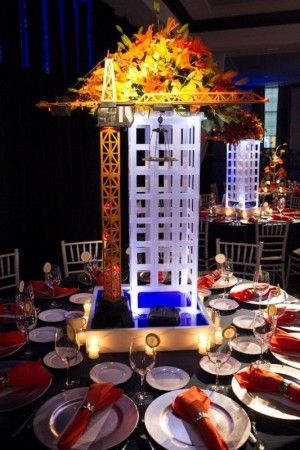 Beautiful skyscraper Bar Mitzvah centerpiece. Bar Mitzvah Centerpieces, 50th Birthday Quotes, Construction Theme Party, Corporate Events Decoration, Auction Ideas, Event Centerpiece, Construction Party, 70th Birthday Gifts, Safety Glasses