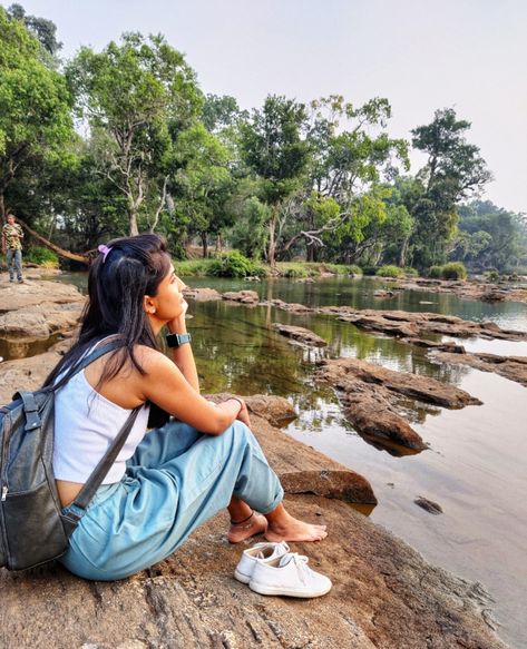 Travel Poses for women near river | Women poses | Lost in thoughts | Travel Story | Travel outfit for women | Cool travel outfit | Prutha Shah #outfitforwomen #travelposes #travel #womenposes #pose #outfit #art #travel #stylehacks #diy Poses Near River, River Poses Photo Ideas, Kerala Trip, Travel Poses, River Photos, Poses For Women, Women Poses, Beach Poses By Yourself Photo Ideas, Trip Photos