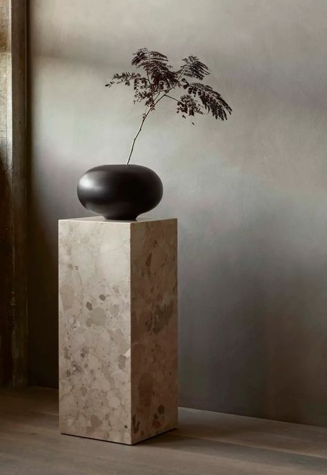 Marble plinth with minimalist round vase and foraged branch | Menu launches a new collection of decorative objects by Colin King | These Four Walls blog Minimalist Flower Arrangement, Colin King, Nero Marquina Marble, Lampe Decoration, Minimalist Flowers, Wooden Vase, Carrara Marble, House Doctor, Bench Table