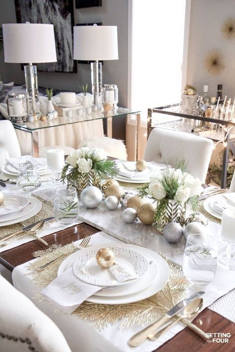 Learn how to create this Elegant Gold And White Christmas Tablescape that's quick and easy to put together! Give white dishes a festive look with white, silver and gold Christmas ball ornaments and beautiful DIY white rose and pine winter centerpieces. This Christmas table decor is perfect for holiday dinner with the family, big dinner parties and winter weddings too! #tablescape #christmas #ChristmasDecor Gold And White Christmas, Dinner Party Table Settings, Winter Centerpieces, Ramadan Decor, Silver Christmas Decorations, Christmas Dining Table, Christmas Dinner Table, Christmas Table Centerpieces, Dinner Party Table