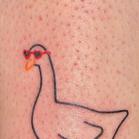 Patrycja ✿ handpoke tattoos ❋ Wrocław on Instagram: "That cute goose spent the whole summer in those heart shaped glasses and had to wait till now to be published. Give her some love 🦆❤️ ______ GUEST SPOTS: 🇫🇷 Paris 20-22.03 DM to book 💌 #handpoke #cutetattoo #stickandpoke #polandtattoos #wroclawtattoo #wroclove #paristattoo #francetattoo #frenchtattoo #lyontattoo #goosetattoo #ducktattoo #heartglasses #birdtattoo #polskietatuaze #kawaiitattoo" Goose With Glasses Tattoo, Mother Duck Tattoo, Silly Goose Tattoo Matching, Duck With Sunglasses Tattoo, Funny Goose Tattoo, Heart Shaped Glasses Tattoo, Goose Outline Tattoo, Heart Shaped Tattoos, Cute Duck Tattoo