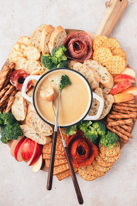 This beer cheese fondue board is one of my favorite fall appetizers! It's super easy to make and sure to be the star of any party spread! 2024 Cheese Board, Fondu Board, Christmas Cheese Fondue, Cream Cheese Fondue, Charcuterie Fondue Board, Charcuterie Board Fondue, Beer Cheese Board, Fall Fondue Party, Cheese Fondue Charcuterie Board