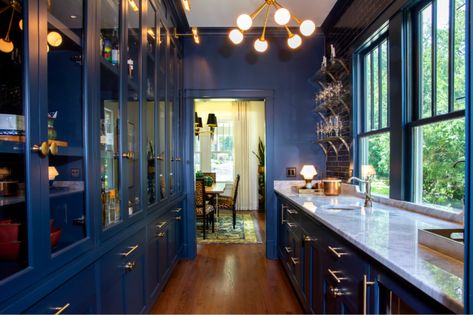 This navy butler's pantry with gold accents and glass floating shelves is not only a center for entertaining but a favorite spot to relax and whip up craft cocktails. Navy Butlers Pantry, Pantry Blue, Antique Mirror Tiles, Faucet Hardware, Home Wet Bar, Floating Glass Shelves, Home Bar Design, Renovation Inspiration, Indoor Bar