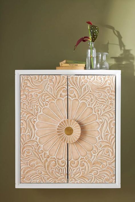 Made from Mango Wood and engraved with botanical motifs, our Gulliver Wall Cabinet doubles as a storage solution and stylish decor. Indian Furniture Traditional, Wood Wall Cabinet, Entryway Cabinet, Natural Wood Texture, Hanging Furniture, Indian Furniture, Woven Baskets Storage, Cabinet Decor, Wall Cabinet