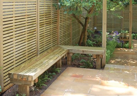 “The garden is designed to make maximum use of the space available and create a tranquil area for relaxing and entertaining." #garden #design #bespoke #bench #seating Sandstone Paving Slabs, Outdoor Fire Pit Seating, Garden Transformation, Shower Cubicle, Building Raised Beds, Garden Fences, Backyard Trampoline, Sandstone Paving, Fire Pit Seating