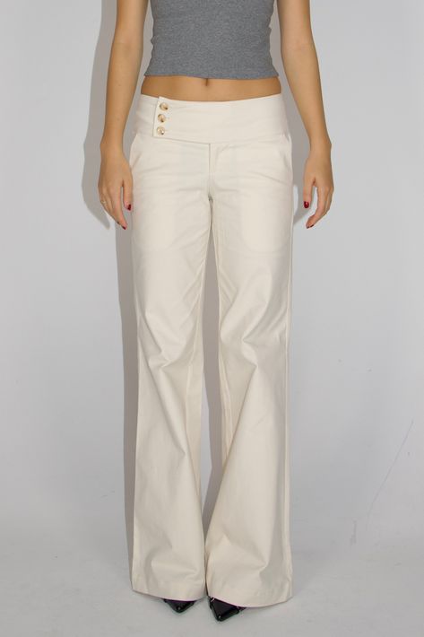 These low-rise, wide-leg cargo pants evoke early 2000s style and can be paired with any top to elevate your outfit. Features Designed to accentuate your curves and showcase the natural contours of your body. Highlighted by three meticulously crafted luxury buttons along the waistband, adding a touch of sophistication to enhance your appearance. Crafted from a smooth cargo material, they gracefully keep the pants in shape and embrace your figure. The low/mid-waisted design with a straight or wide Chic Things List, White Dress Pants Outfit Classy, Pants Pocket, White Bottoms Outfit, Back Pocket Design, Low Waisted Trousers, Cute Cargo Pants, Comfortable Clothes, Designer Pants