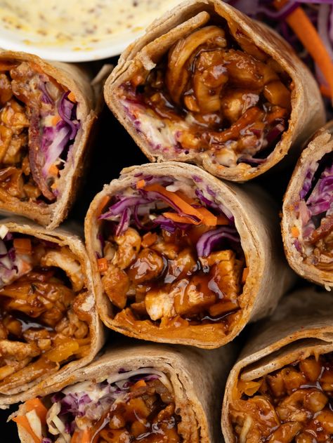 Chicken wrap filled with juicy made from scratch BBQ Chicken, crunchy veggies, cheese, and a mustard mayo sauce. These BBQ Chicken Wrap makes for a filling and nutritious meal that’s perfect to pack for lunch and a quick grab and go meal. Meet our favorite summer lunch!! Tender BBQ chicken breast, crunchy coleslaw, red onion,... Barbecue Chicken Wrap, Bbq Chicken Wraps Healthy, Bbq Chicken Wrap Recipes, Mustard Mayo Sauce, Easy Chicken Wrap, Baked Bbq Chicken Recipes, Crunchy Coleslaw, Chicken Wraps Healthy, Chicken Thigh Seasoning