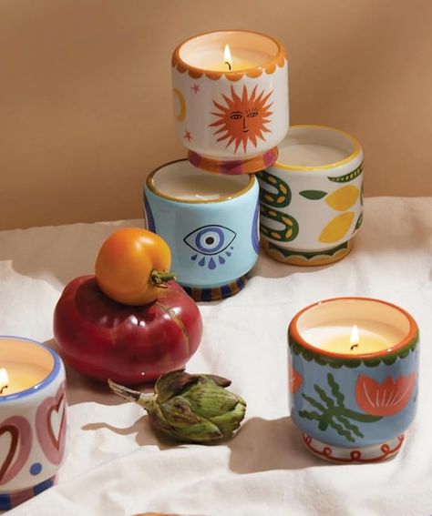 A DOPO SCENTED CANDLE Inspired by the colors and patterns of Morocco, the A Dopo candle collection features ceramic footed pots with hand-painted details and hand drawn dust covers APPROXIMATELY 48 HOURS OF CLEAN BURN TIME Artisan ceramic vessel is poured in the USA with 8-ounces of our soy wax blend free of formaldehyde, phthalates, and animal-sourced ingredients; burn times may vary due to environment; for best results, place candle away from drafts, always trim wicks, and let the wax pool ful Clay Candle Pots, Painting On Pots, Diy Ceramic Painting, Ceramic Candles, Candle Ceramic, Candle Painting, Candle Vessels, Candle Pot, Paint Ceramic