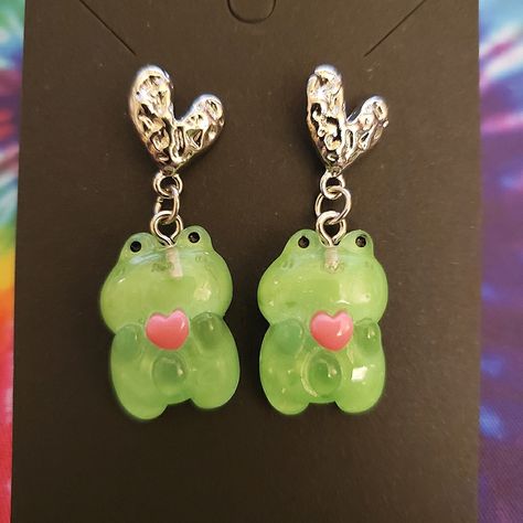 Adorable Handmade Kawaii Frog Heart Earrings. Cute For Everyday Outfits, Cosplays, Etc. -Handmade By Me, New, No Tags -Hearts Made Of Metal -Earrings Hang Down 1.53 In When Worn -Made With Green And Pink Resin Frog Charms (0.63 In Wide X 0.84 In Long) -Have Earring Backings Attached Other Similar Items Are Also Available In My Closet. Tags: Edc, Edm, Rave, Music Festival, Kandi, Plur, Cosplay, Convention, Gamer, Kawaii, Rabbit, Frog, Strawberry, Animals, Fruit, Rave Gear, Sanrio, Japan, Sakura, Strawberry Animals, Frog Strawberry, Festival Kandi, Resin Frog, Frog Heart, Fossil Earrings, Cosplay Convention, Kawaii Rabbit, Japan Sakura