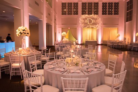 Wedding Reception all White Decor with Chiavari Chairs, Tall Floral Centerpieces and Projection Bride and Groom Initials GOBO and Pink Uplighting | Tampa Wedding Lighting Nature Coast Entertainment Services | Tampa Wedding Venue The Vault | Tampa Wedding Planner Special Moments Uplighting For Wedding Reception, The Vault Tampa Wedding, White Uplighting Wedding, Pink Uplighting Wedding, Tall Floral Centerpieces, All White Decor, Pink Uplighting, Wedding Uplighting, Vintage Wedding Venues