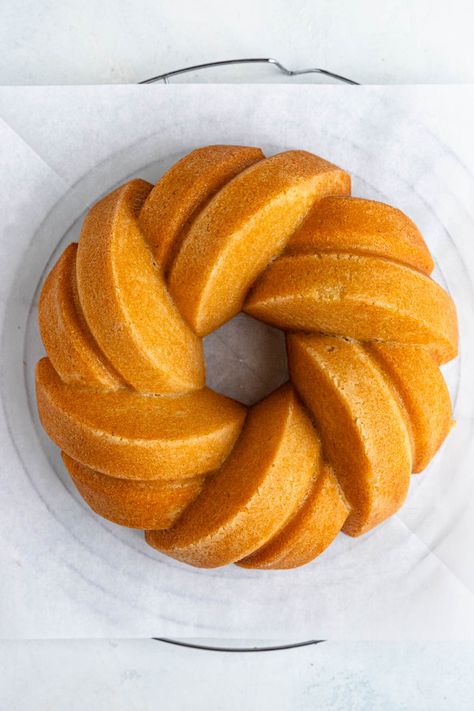 Moist Vanilla Bundt Cake with Vanilla Glaze - Bakes by Brown Sugar Swirl Bundt Cake, Bundt Cake Recipes Vanilla, Vanilla Pound Cake Recipes Moist Bundt, Moist Vanilla Bundt Cake, Vanilla Glaze For Bundt Cake, Butter Poundcake Bundt Cakes, Vanilla Bundt Cake Recipes, Bundt Pan Recipes, Cage Free Eggs