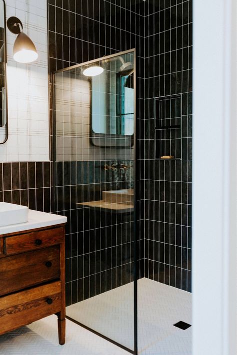 Black Subway Tile Shower Wall, Black Glass Tile Bathroom, Black Tile In Shower Wall, Black Vertical Subway Tile Bathroom, Bathroom Black Tile Wall, Black Tile White Tub, Black Tile Shower Bathroom, Black Tile Walk In Shower Ideas, Black Tile Shower Wall