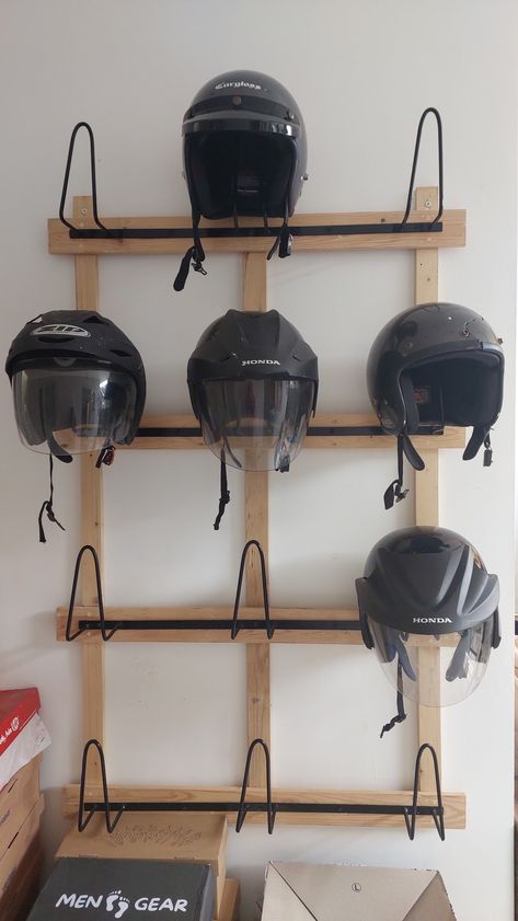 Helmet Storage Ideas Diy, Welding Helmet Storage, Helm Cargloss Aesthetic, Ski Helmet Storage, Helmet Storage Ideas At Home, Helmet Hanger Ideas, Diy Motorcycle Helmet Rack, Snowmobile Helmet Storage, Bicycle Helmet Storage