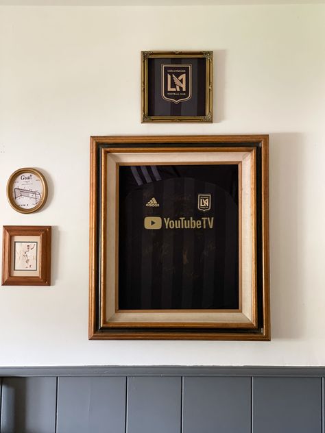 DIY framed jersey/t-shirt using a thrifted frame, LAFC jersey, framed LAFC jersey, soccer themed kid's room, jersey display ideas, framed t-shirts T Shirt Display Ideas Wall Art, Framed Shirts Display, Framed Soccer Jersey, T Shirt Frame Display, Framed Football Shirts On Wall, Diy T Shirt Display, Framed Jerseys On Wall, Jersey Frame Ideas, Frame Jersey Ideas