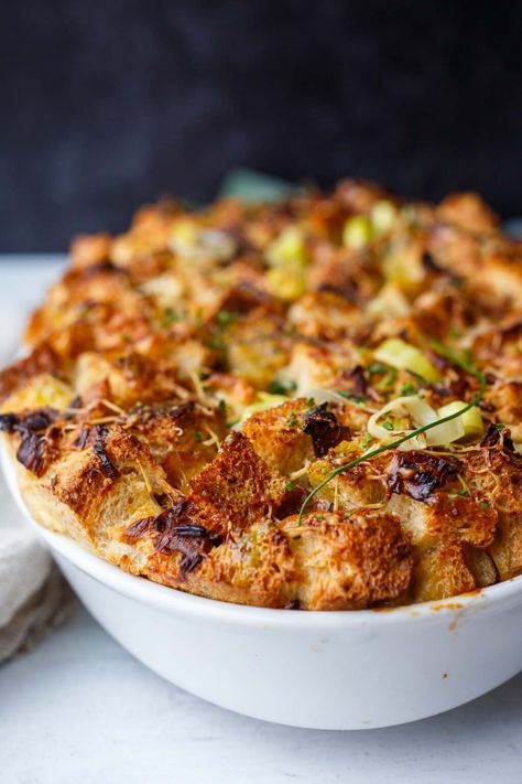 This Savory Bread Pudding with leeks and gruyere is as cozy as it gets!  A delicious and comforting side dish or vegetarian main- perfect for special dinners or the holiday table. (Adapted from Thomas Keller's recipe- but a little lighter!) Leek Recipes Side Dishes, Leek Bread Pudding, Leek Bread, Thomas Keller Recipes, Savory Bread Pudding, Winter Side Dishes, Vegetarian Thanksgiving Recipes, Savory Bread Puddings, Leek Recipes