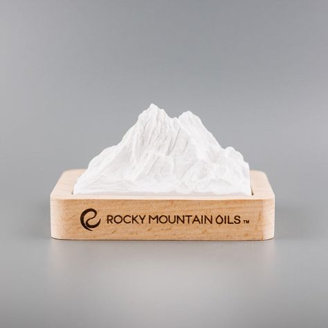 The Rocky Mountain Ceramic Passive Diffuser brings the essence of nature into your space. This elegant diffuser, inspired by the majestic Rocky Mountains, quietly releases your favorite essential oils without electricity or heat. Its compact size (4.25" x 3" x 2.25") makes it perfect for any room, while the durable ceramic and wood construction ensures long-lasting use. Experience the benefits of aromatherapy with this eco-friendly, low-maintenance Rocky Mountain Ceramic Passive Diffuser. Passive Diffuser, Gas Chromatography, Nature Meaning, Month Gifts, The Rocky Mountains, Pure Essential Oils, Rocky Mountain, Wood Construction, Essential Oil Diffuser