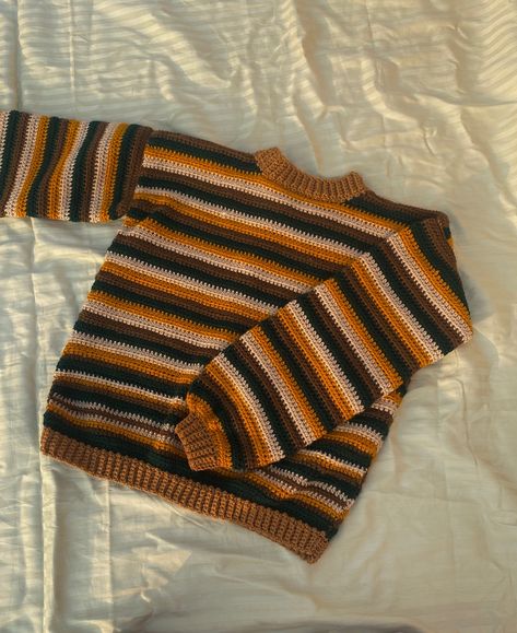 Crochet autumnal striped sweater🤎🍁🧶 OMG!! I LOVE IT specially the collar I LOVE HOW IT SITS ON MY NECK💖🌷 I know it’s winter now but who cares🤭 I wanted to add more touch of rusty colors but I couldn’t get those colors that time therefore I bought these. I wasn’t sure about the color combos but they turned out amazing🤎 I’ve been having crochet sweaters all around my fyp specifically the striped ones and they caught my attention then I searched more on Pinterest and yes decided to make one. A... Crochet Sweater Striped, Crochet Sweater Stripes, Stripe Crochet Sweater, Crochet Striped Sweater, Scrap Yarn Crochet, Stripe Crochet, Striped Knitted Sweater, Crochet Tutorial Pattern, Crochet Sweaters