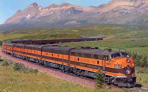 One of the famous Great Northern publicity photos featuring its flagship transcontinental service, the "Empire Builder," rolling downgrade over Marias Pass near Browning, Montana outside of Glacier National Park circa latter 1950's.  The "Builder" of this period featured the very best in rail travel including Great Dome reclining seat coaches, standard coaches, Ranch Lounge, Pullman sleepers, diner, Great Dome lounge, and a lounge-observation. Great Northern Railroad, Railroad Images, J Hill, Railroad History, Scenic Railroads, Railroad Pictures, Burlington Northern, Luxury Train, Railroad Photography