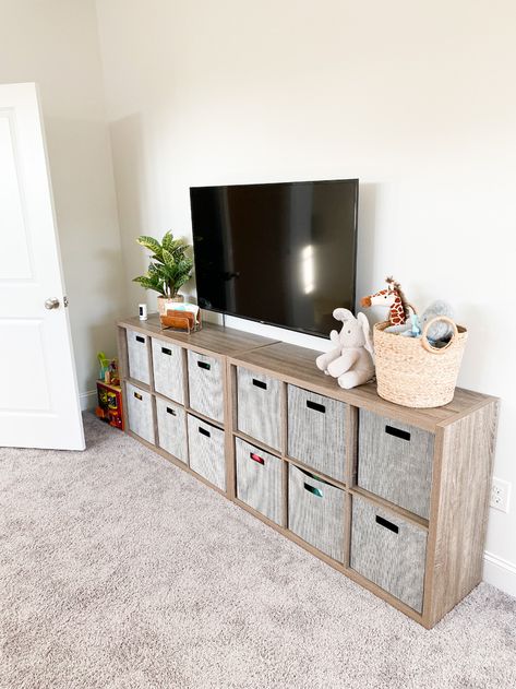 Cube Storage Tv Stand Playroom, Cubby Storage Under Tv, Living Room Under Tv Storage, Playroom Cubby Storage, Tv Unit Toy Storage, Tv Stand Toy Storage Ideas, Playroom Cube Organizer, Living Room Toy Storage Under Tv, Cube Storage Under Tv