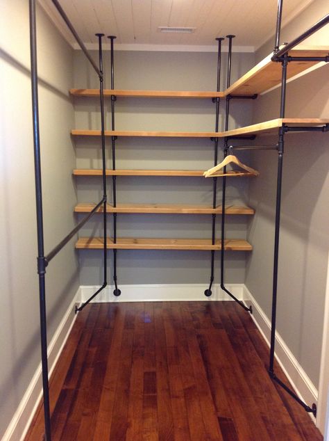 My new closet!  Re-purposed wood and pipe fittings from the hardware store = a fabuluosly industrial chic closet.  Inspired by domestiphobia.net and courtesy of my GC. Industrial Pipe Closet, Pipe Closet, Wood Closet Shelves, Koti Diy, Walking Closet, Closet Remodel, Pipe Furniture, Closet Shelves, Diy Closet