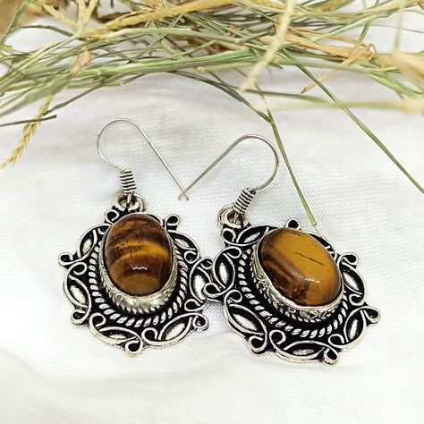 "Tiger Eye Treasure" - Add a touch of elegance to your outfit with these handmade dangler earrings featuring natural tiger eye gemstone. Handcrafted with love, these unique pieces are sure to make a statement. . . #TigerEye #HandmadeJewelry #DanglerEarrings #NaturalGemstones #ElegantAccessories #UniqueFashion #GemstoneJewelry #FashionAccessories Dangle Bracelet, Jewelry Wood, Tiger Eye Gemstone, Dangler Earrings, Tigers Eye Gemstone, Eye Earrings, Stone Collection, Tiger's Eye, Elegant Accessories