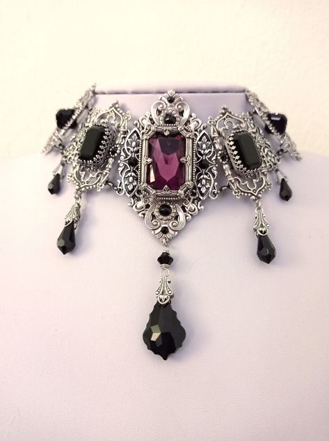 Silver Gothic Choker Necklace with Purple and Black Swarovski crystals Welcome to my latest design, one of my most impressive and exceptional chokers! If you're looking for a piece out of a fairytale to adorn your neck, you've come to the right place. This is one of those pieces that period fantasy books describe and have your imagination going wild trying to pictur...#Accessories #HandmadeJewelry #Gemstone #Fashion #StatementJewelry #JewelryLovers #Jewelry #JewelryDesign #Style #JewelryAddict Victorian Gothic Jewelry, Gothic Choker Necklace, Crescent Moon Necklace Silver, Victorian Accessories, Purple Gothic, Gothic Choker, Victorian Necklace, Gothic Chokers, Gothic Accessories