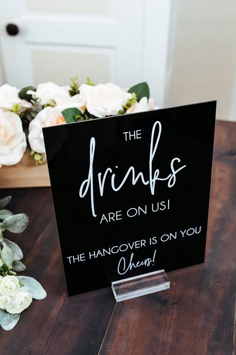 Click on the following link to browse HUNDREDS more designs in our shop!! www.etsy.com/shop/pinkposiesandpearls The Drinks Are On Us, The Hangover Is On You Clear Glass Look Acrylic Wedding Sign, Drink Coolers Favors Lucite Table | Welcome to Pink Posies and Pearls Wedding and Gift Boutique | | THE PRODUCT | *We love the clean lines of this clear acrylic sign. The sign shown features white lettering on clear acrylic, but you can choose to print any color lettering on either clear, black, white o Cute Wedding Day Ideas, Welcome Drink Wedding Ideas, Appetizer Sign Wedding, The Drinks Are On Us Wedding Sign, Things To Have At A Wedding, Wedding Signing Board, Welcome Drink Ideas, Black And White Wedding Decorations, White Themed Wedding