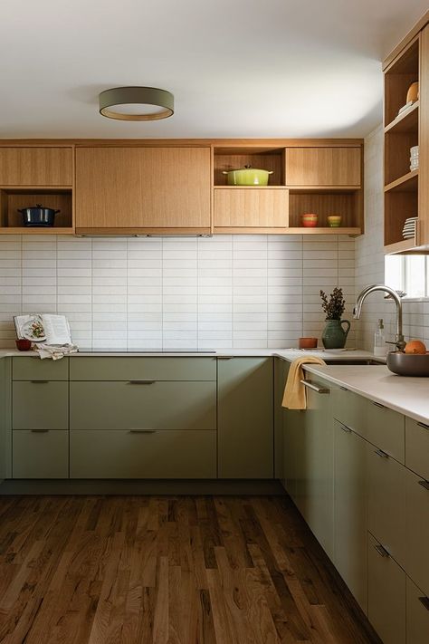 This kitchen features minimalistic cabinetry in a soft, pale green hue and a complimentary wood. The goal was to create a refreshing and contemporary ambiance while paying homage to the home's Mid-Century architecture. I think our talented team nailed it!⁠ 🙌🏻⁠ Mid Century Kitchen Cabinets, Mid Century Kitchen Remodel, Interior Design Classes, Pale Wood, Green Kitchen Cabinets, Mid Century Architecture, Green Cabinets, Mid Century Kitchen, Online Interior Design