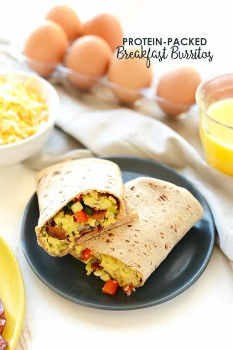 Start your day off right with a protein-packed homemade breakfast burrito! Made with eggs, crispy bacon, and cheese, these burritos keep you full all day long. Diy Frozen Breakfast, Frozen Breakfast Burritos, Breakfast Burritos Frozen, Packed Breakfast, Breakfast Burritos Recipe, Frozen Breakfast, Macro Friendly Recipes, Breakfast Burrito, Burritos Recipe