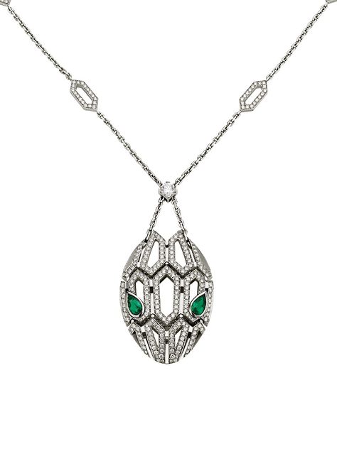 From the Serpenti Seduttori Collection. Capturing the snake's innate power of attraction, the Serpenti pendant glorifies the head of the mythical animal, focusing on the magnetic power of the eyes. A striking diamond station necklace cast in gleaming 18K white gold with emerald eyes and pavé diamonds. Diamonds, 2.63 tcw Emeralds, 0.96 tcw 18K white gold Lobster clasp Made in Italy SIZE Adjustable length, about 16.9"-17.7" ABOUT THE BRAND Founded in Italy in 1884 by Greek silversmith Sotirio Bulg Bvlgari Necklace Snake, Bvlgari Necklace, Emerald Pendant Necklace, Power Of Attraction, Bulgari Jewelry, Emerald Necklace Pendant, Bvlgari Serpenti, White Gold Pendant Necklace, Emerald Eyes