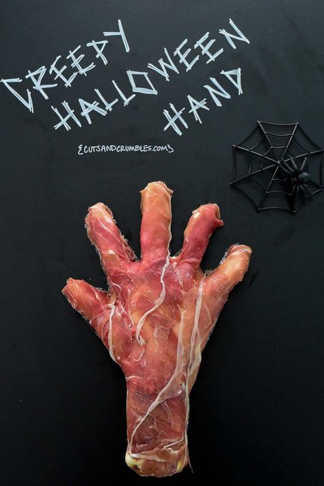 Creepy Halloween Hand Recipe--A flavored cream cheese dip shaped into a creepy hand and wrapped in prosciutto to make a disturbingly realistic Halloween appetizer! Freak out your party guests with this simple, tasty, totally edible (if you can stomach it) eerie snack! {cutsandcrumbles.com} #Halloween #creepy #weirdfood #Halloweenappetizer #Halloweenparty #festivefood #prosciutto #appetizer #creamcheesedip #makeaheadappetizer #partyfood #nocookappetizer #cutsandcrumbles Basil Strawberry, Flavored Cream Cheese, Halloween Appetizer, Smoked Mac And Cheese, Creepy Food, Creepy Halloween Food, Creepy Hand, Cream Cheese Dip, No Cook Appetizers