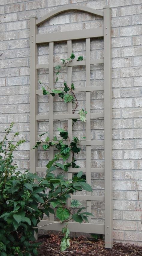 Add a touch of elegance to your yard with this durable, easy-to-assemble trellis. Maintenance is as simple as spraying clean with a garden hose and 20-year warranty ensures that the trellis will not fade, peel or crack. DuraTrel 28-in W x 76-in H Mocha Vinyl Traditional Garden Trellis in White | 11172M Trellis Arch, Vinyl Lattice Panels, Cedar Trellis, Obelisk Trellis, Taman Diy, Iron Trellis, Wall Trellis, Trellis Fence, Arch Trellis