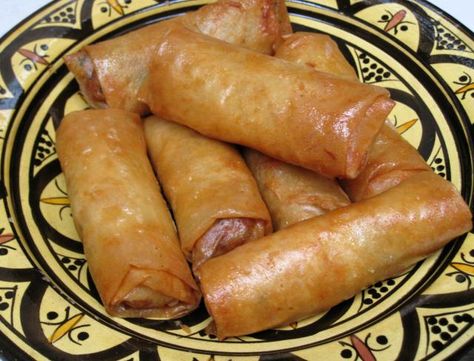 Moroccan briouats are small, crispy stuffed pastries. This popular version is stuffed with chicken seasoned with saffron, ginger and cinnamon. Moroccan Desserts, Chicken And Pastry, Moroccan Chicken, Ginger And Cinnamon, Savory Chicken, Moroccan Food, Ramadan Recipes, Drinks Recipes, Authentic Recipes