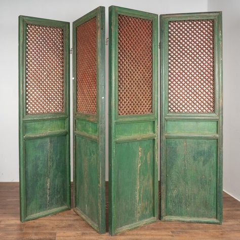 A set of four large carved elm wood interior folding screen panels that still maintain their original green painted finish, topped by traditional Chinese fretwork design left in contrasting natural wood with faint, residual red paint. Each of the four of large panels captures one's attention with the mesmerizing carved fretwork that allows light to pass through this room divider. Solid, stable and all hinges in place. Any scratches, cracks, dings, or age related separation are reflective of age Folding Screen Decor, Vintage Dressing Screen, Chinese Screen Divider, Room Divider Aesthetic, Vintage Partition, Victorian Room Divider, Traditional Chinese Interior, Folding Divider, Vintage Room Divider