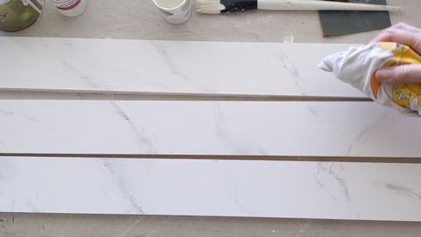 This Faux Marble Console Table is without a doubt, tied for first place among my favorite Home Decor DIYs. I would also have to throw in my Oyster Shell Mirror and the Original Console Table into the mix.Not only am I tickled with the way the faux marble top and apron came out, but the acrylic legs just add a whole level of ‘way cool’ to my new sofa table. Materials Needed for Faux Marble for the Console Table with Acrylic Legs      A piece of low-grain wood, like poplar or a… Wood Grain Filler, Oyster Shell Mirror, Painted Rock Cactus, Childrens Desk, Marble Console Table, Shell Mirror, Diy Planter Box, Marble Console, New Sofa