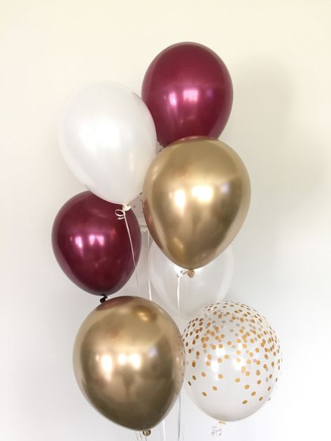 Burgundy, white and gold balloons! These balloons are the perfect way to make a pop at your next event! This (8-count) Burgundy and Gold Balloon Bouquet includes:2 Burgundy Latex 11 Balloons2 White Latex 11 Balloons2 Clear with Gold Dots Latex 11 Balloons 2 Chrome Gold Latex 11 Balloons*For more fu Burgundy Balloons, Burgundy Birthday, Blush Balloons, Quinceanera Decorations, Maroon Wedding, Bridal Shower Decor, Gold Bridal Showers, White Balloons, Gold Balloons