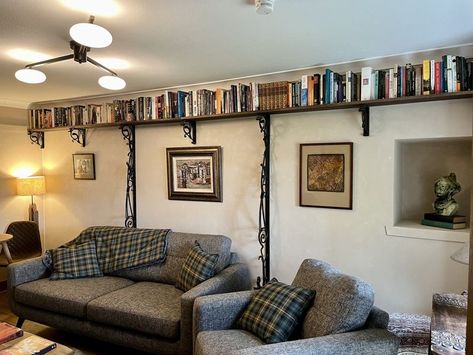 The Librarianologist | I've now completed the first phase of mounting my books on overhead shelves throughout my cottage | Facebook Book Shelves Around Top Of Room, Ceiling Mounted Shelves, Overhead Shelves, Room With Bookshelves, Ceiling Shelves, Floating Bookshelf, Mounted Shelves, Book Nook, My Books