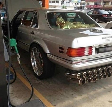 cursed image of a car with way too much exhaust outlets, big rims and chilling statue in rear mirror 4m6c9hx Old Car Parts, Computer Humor, Car Mods, Car Images, Old Car, Cute Cars, Car Car, My Ride, Car Ins