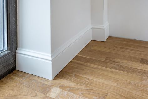 Tall Baseboards, How To Install Baseboards, Splitting Wood, Baseboard Styles, Shower Plumbing, Huge Mirror, Baseboard Trim, Kitchen Cabinets And Countertops, Colour Architecture