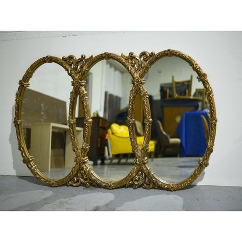 A spectacular large-scale Mid-Century Triple Oval Interlocking Acanthus Decorated Gold Wall Mirror boasting exquisite details. Made of resin, the gold frame is decorated with acanthus leaves and floral motifs. Ideal for a bar, restaurant, or hotel lobby. Ready to hang.   DIMENSIONS  Height 43, Width 66, Depth 2 inches  CONDITION NOTES  An excellent piece in perfect condition.    DELIVERY  Nationwide delivery or local FREE pick up in the Chicago area available. Gilded Mirror Decor, Mirror Collage Wall, Mirror Over Fireplace, Large Vintage Mirror, Wall Mantle, Antique Wall Mirror, Large Oval Mirror, Mirror Collage, Gothic Mirror