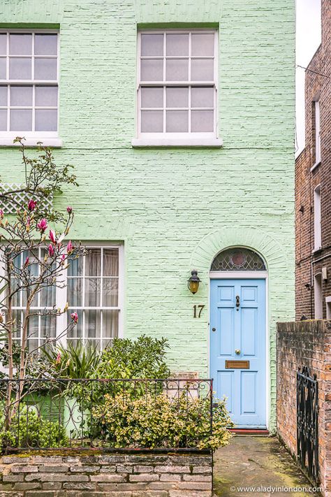 This pastel green house with a blue front door in Earls Court is great. This guide to Earls Court, London will show you Earls Court road, restaurants, pubs, mews, and lots of pretty houses and doors. #earlscourt #london #house #pastels Exterior Brick Paint Colors, Brick Paint Colors, Earls Court London, Green House Exterior, Lovely Houses, Colorful Doors, English Houses, Earls Court, Airbnb Design