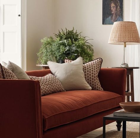 Rust Sofa Living Room Burnt Orange, Rust Colour Sofa Living Rooms, Copper Orange Sofa, Cream Sofa Rust Cushions, Rust Sofa Living Room Ideas, Red Sofa Decorating, Soho Home Rust Sofa, Red Sofa Living Room, Havenly Living Room