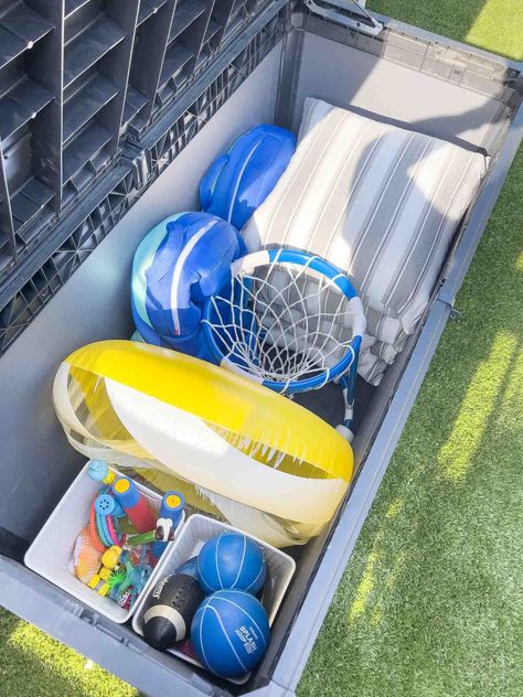 5 Pool Storage Ideas To Keep the Pool Area Tidy - Kelley Nan Bathroom Tray Decor Ideas, Pool Storage Ideas, Pool Towel Storage, Float Storage, Bathroom Tray Decor, Pool Organization, Pool Float Storage, Pool Pumps And Filters, Pool Toy Storage