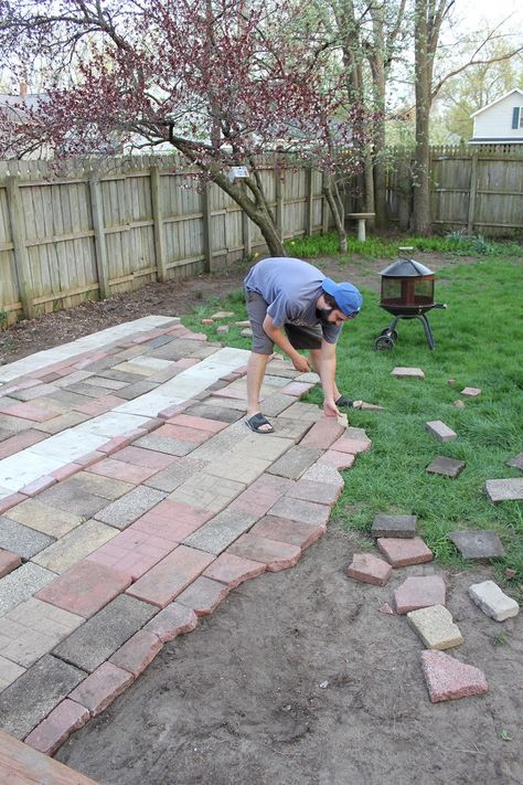 Digging around the yard unearthed a random paver or two - or hundred, all mix-matched and beautiful. As Mike and I stacked, we decided not... Reclaimed Brick Patio, Laying A Patio, Paver Sand, Unique Patios, Wheelbarrow Planter, Tire Planters, Reclaimed Brick, Stone Pathway, Brick Patios