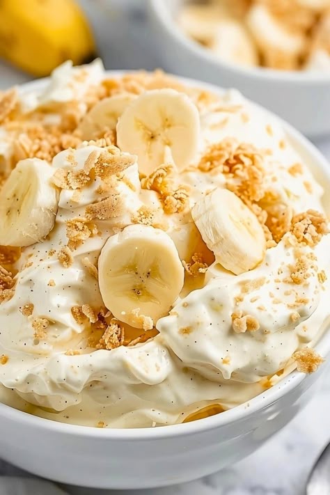 Dreamy banana pudding fluff is the perfect no-bake dessert for your next potluck or party. It comes together in minutes, and it's impossible to resist. Banana Pudding Fluff, Pudding Fluff, Easy Peanut Brittle Recipe, Fluff Salad Recipes, Banana Pudding Desserts, Easy Banana Pudding, No Bake Banana Pudding, Peanut Brittle Recipe, Fluff Salad